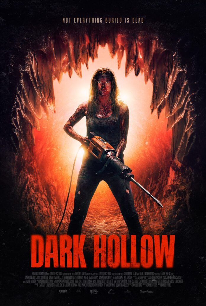 Dark Hollow 2026 poster featuring a blood-covered woman holding a chainsaw inside an underground cave