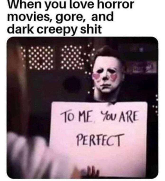 Michael Myers holding a sign that says “To me, you are perfect” in a horror meme