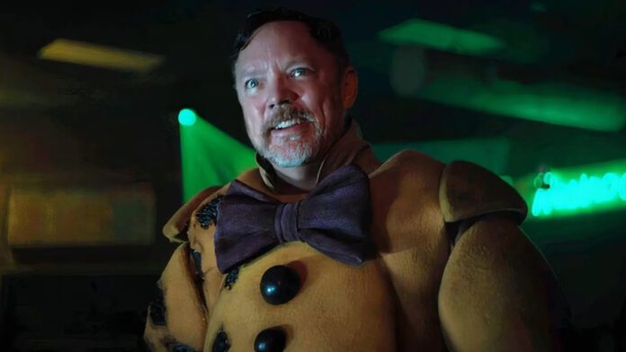 Matthew Lillard as William Afton wearing a yellow animatronic costume in Five Nights at Freddy's
