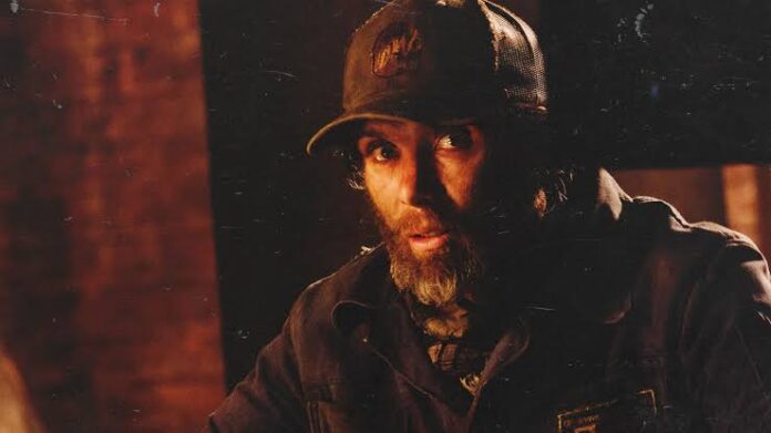 Cillian Murphy as Emmett in a dark, tense scene from A Quiet Place Part II, ahead of his return in A Quiet Place Part III.