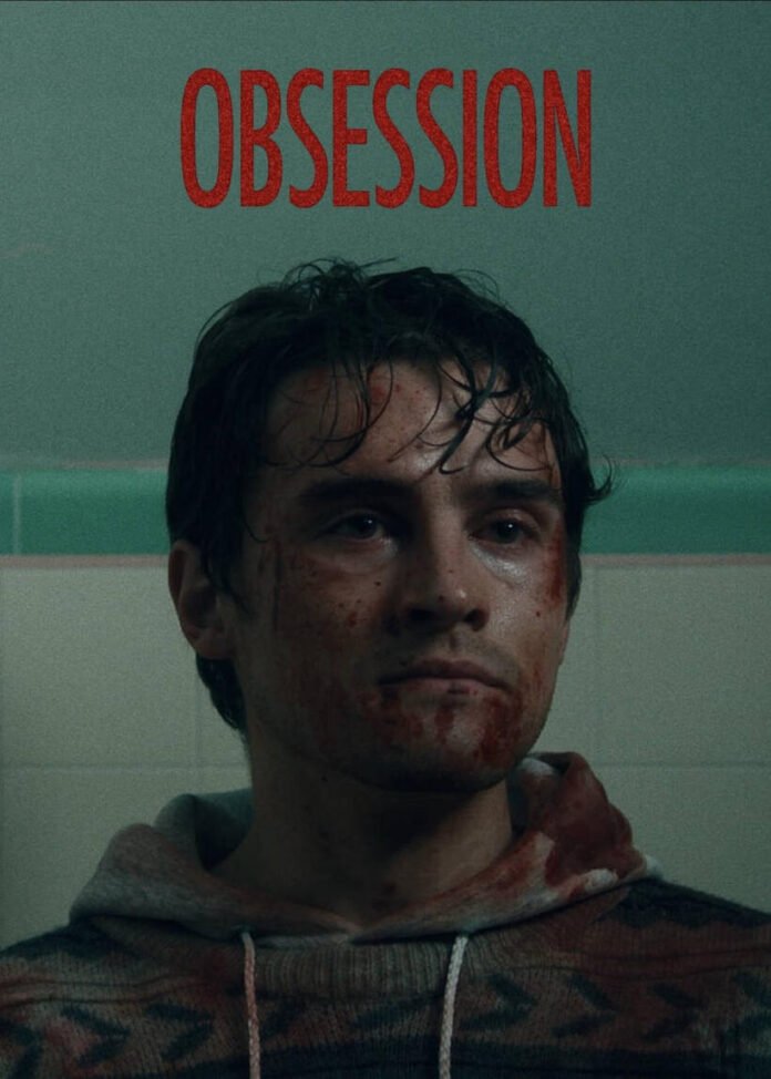 Michael Johnston in a blood-stained hoodie in a scene from the horror film Obsession