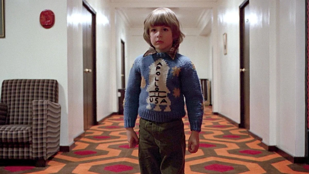 The Shining (1980) — Danny in the Overlook Hotel.